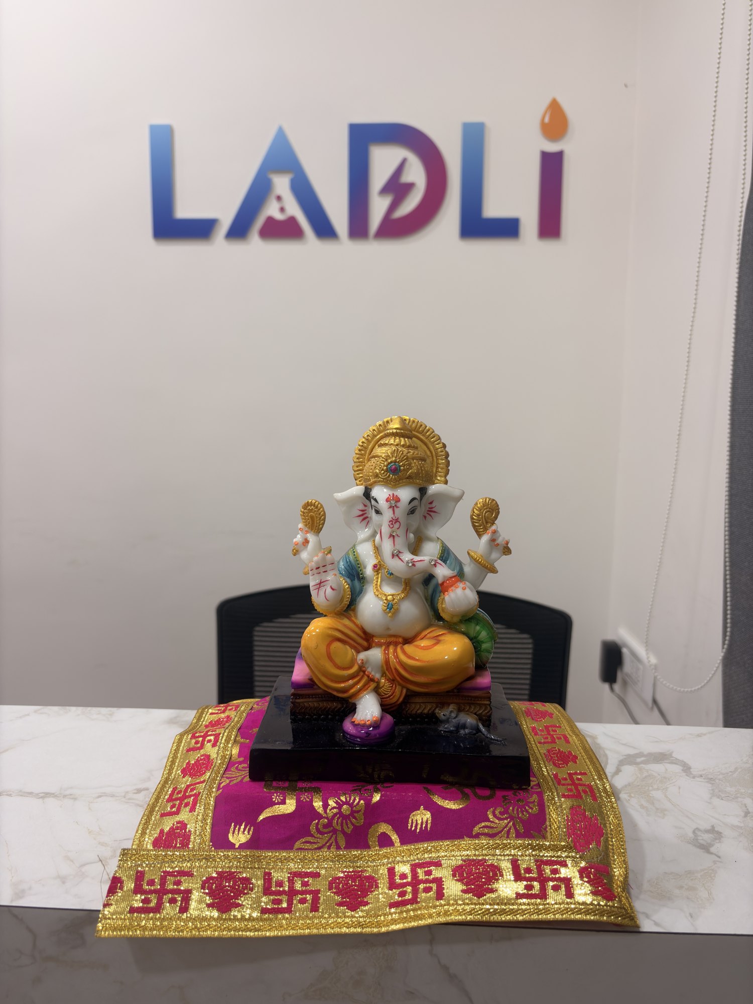 LADLI wall logo and Ganesh idol at the laboratory